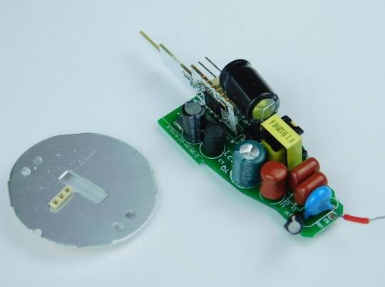 The PCB alongside the LED panel with metal plating